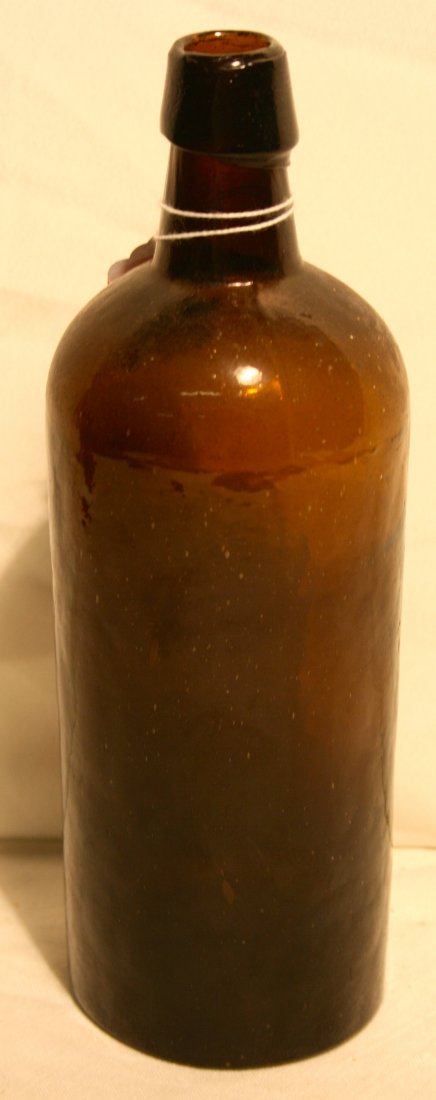 Bottle, Honey amber, Stoddard, NH: Bottle, honey amber, Master utility, applied cap, single dot mark, attributed to Stoddard Glass works, NH 9.5" tall,