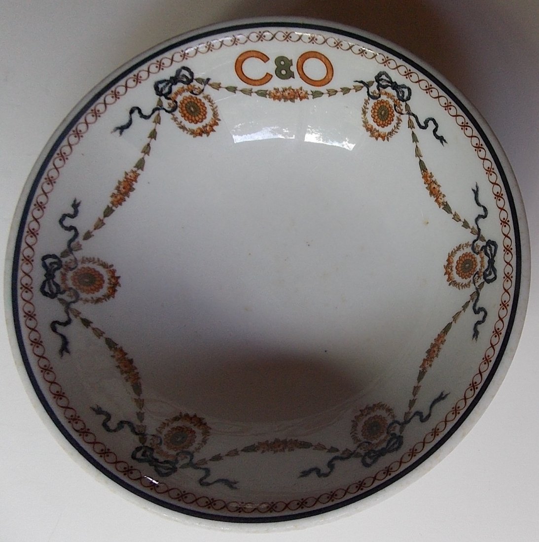 Chesapeake & Ohio "Charlottesville" China Bowl: This C&O Railroad bowl was made by Syracuse OPCo) with a date code of "5-J". It measures 6 1/4" in diameter and it stands 2" tall. The "C&O" logo is sharp. There are some utensil marks in the food wel