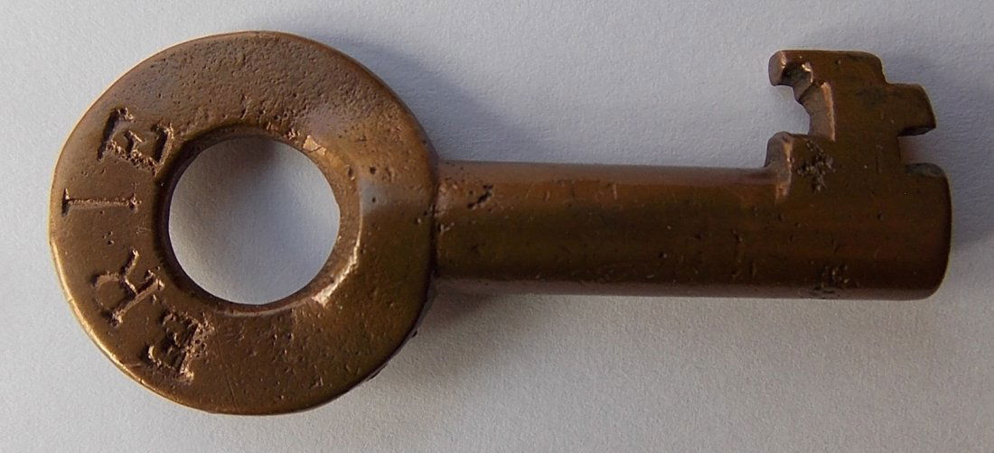 Erie Railroad Brass Switch Key " Fraim: This Erie key has the Fraim "dog bone" hallmark. This is the standard switch bit according to the Key Lock & Lantern diagrams. A clean looking key with little wear.