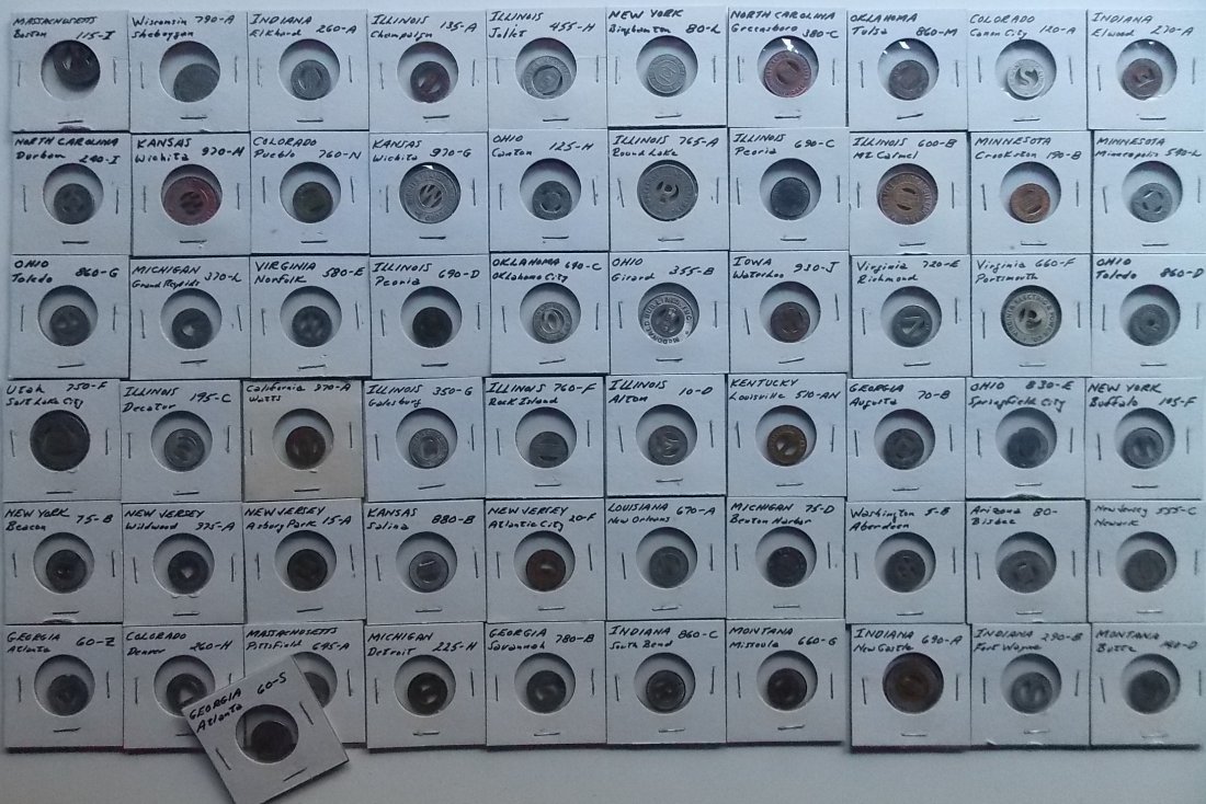 61 Transit & Trolley Tokens: About 61 transit and trolley tokens. All are in stapled coin holders. I saw no duplicates. Locations vary but I did see quite a few Illinois, Indiana and more. Please see the pictures for more details