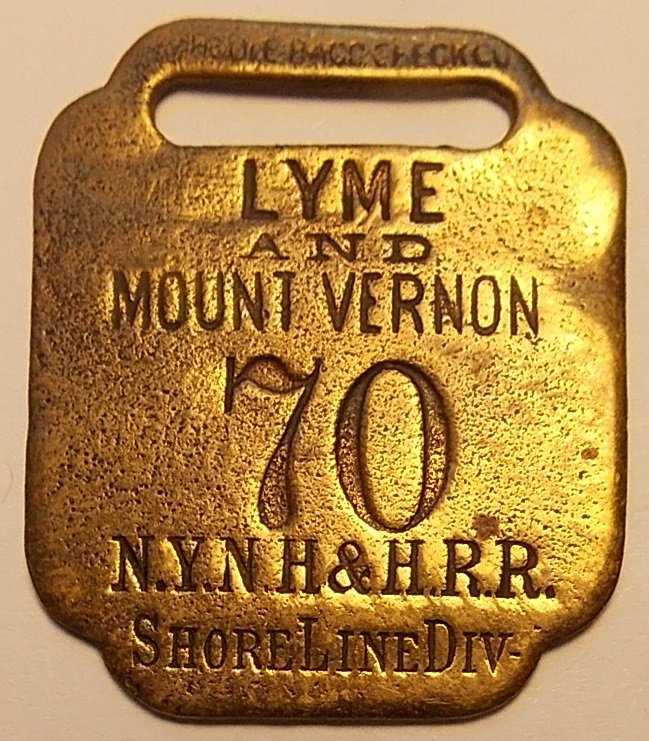 New Haven Railroad Baggage Tag Lyme CT: A passenger receipt brass baggage tag used on the New York New Haven & Hartford Railroad. This is tag #70 and the trip was from/to Lyme Connecticut and Mount Vernon, New York. It's interestig that is 