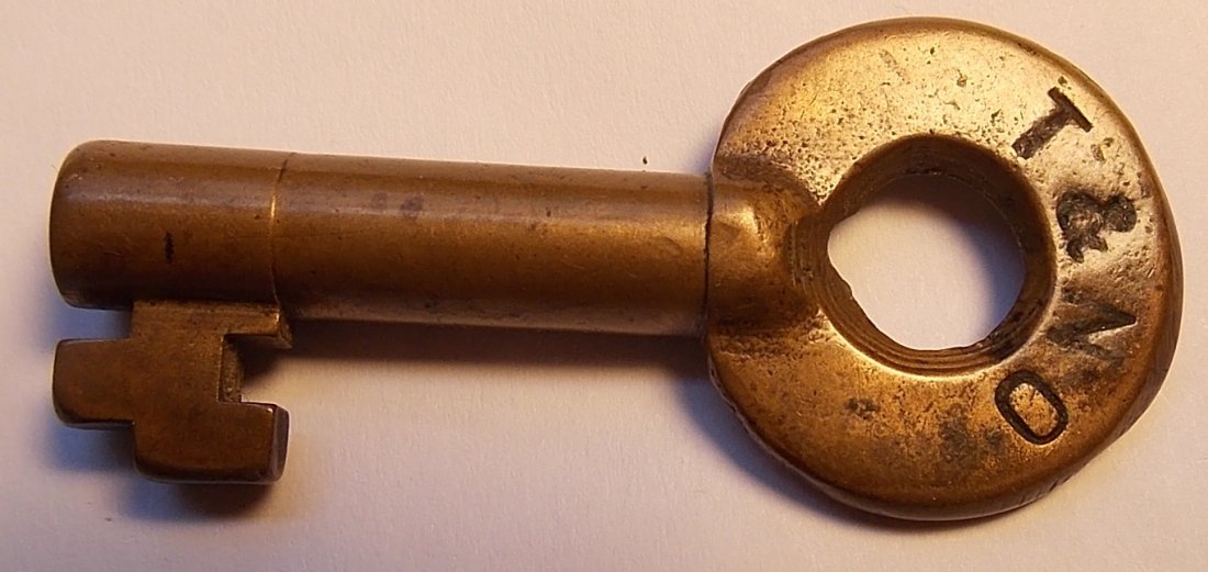 Texas & New Orleans Railroad Switch Key: This key is just stamped T&NO on the front. It has Adlake in an arc on the reverse. It has moderate pocket wear and a little use wear. This is a Southern Pacific affliated line.
