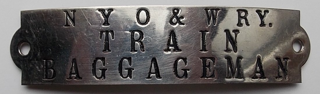 NYO&W RR Train Baggageman Hat Badge: A new York Ontario & Western Railroad Train Baggageman hat badge. A standard O&W rectangular shape with a very nice older S. M. Spencer hallmark on the reverse. An unusual occupation from a collectibl