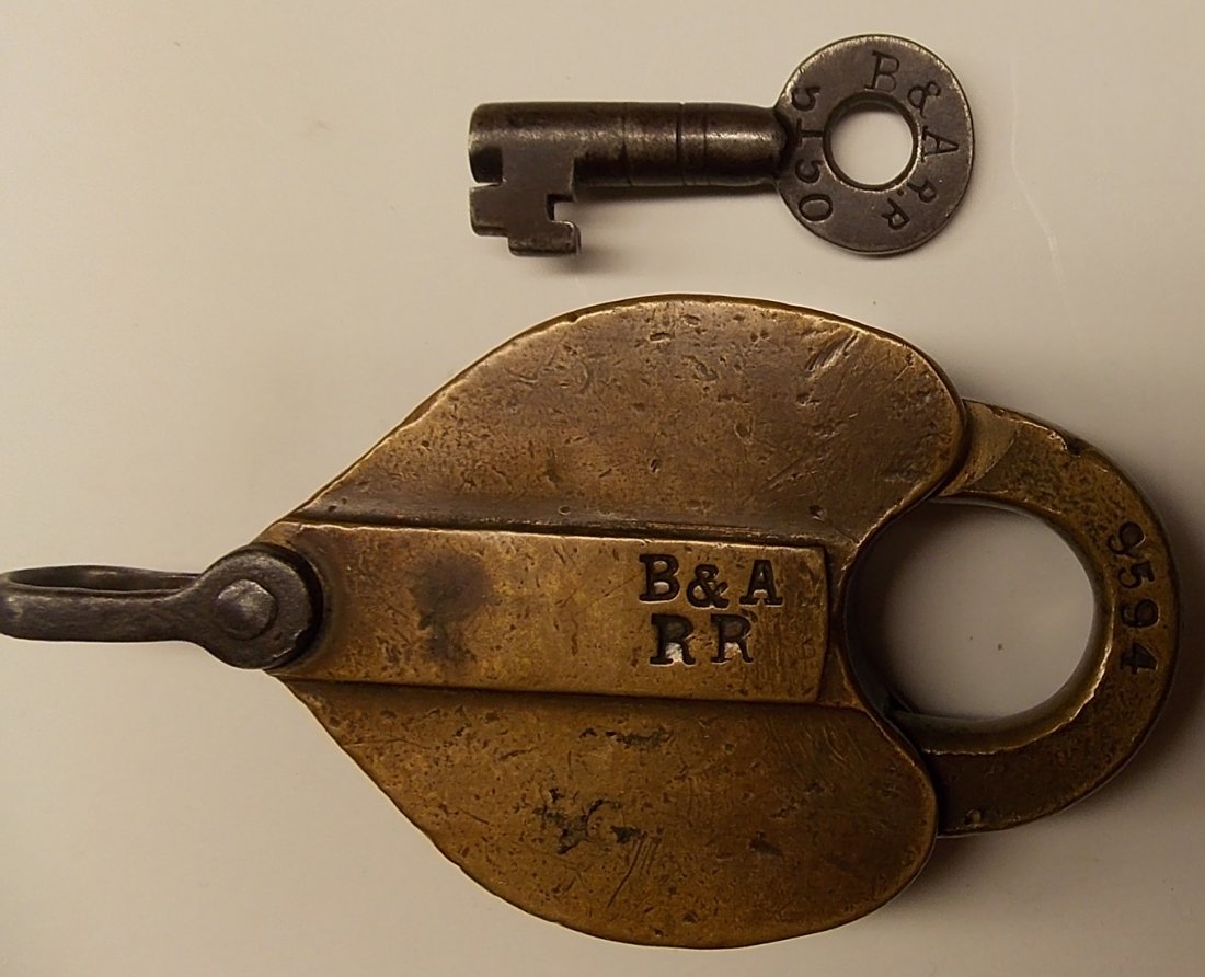 Boston & Albany Railroad Lock and Key: A nice older Ritchie & Son lock. The Ritchie hallmark on the shackle seems unusual to me. It has a number of 9594. The key is an older steel Ritchie & Son with B&A and then the smaller straight line R