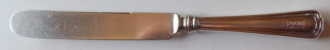 Rutland Railroad Silver Dinner Knife: A Rutland Railroad dining car silver plated dinner knife. Rutland dining car items are hard to find. It measures about 8 1/2" long. The box logo is sharp. There is little wear. The blade has a faint M