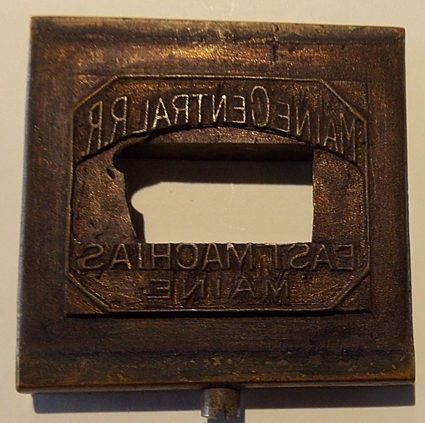 Maine Central Railroad East Machias Dater Die: This die has lots of ink clouding up the image. I didn't want to polish it for better photographs just in case somebody wants it to have this old used look. East Machias is Down East on the Washington