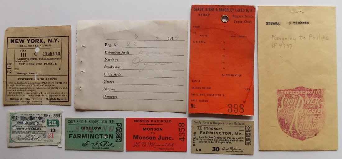 Maine 2 Footer Ephemera - tickets, tags, etc: An eclectic group of ephemera that features a cardstock Sandy River & Rangeley Lakes Railroad Corpse tag. Some tickets, a Philips & Rangeley bond coupon, a ticket envelope and a locomotive #22 inspect