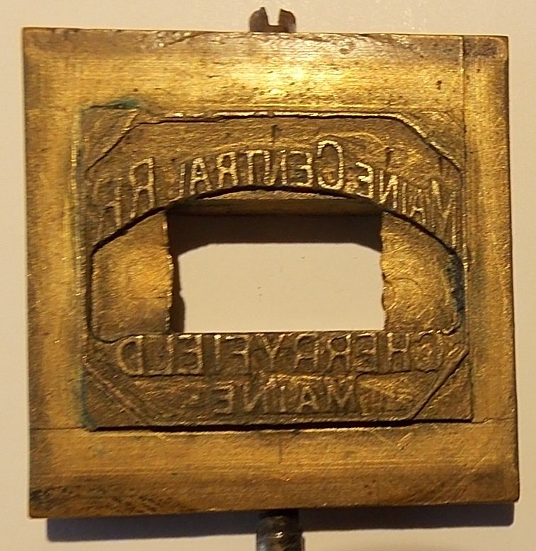 Maine Central Railroad Cherryfield Dater Die: This die is in fine condition. The photo is a little out of focus. Cherryfield is Down East and it was once the blueberry capitol of the world. We saw a bear lope across the highway here years ago. Th