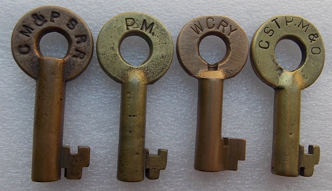 4 Midwest Key: CM&StP, PM, WC, CStPM&O: A group of 4 Midwest based keys: (1) Chicago Milwaukee & St Paul made by Loefelholtz (2) Pere Marquette made by Adlake (3) Wisconsin Central (not Washington County - see Key Lock & Lantern Page 563 C1