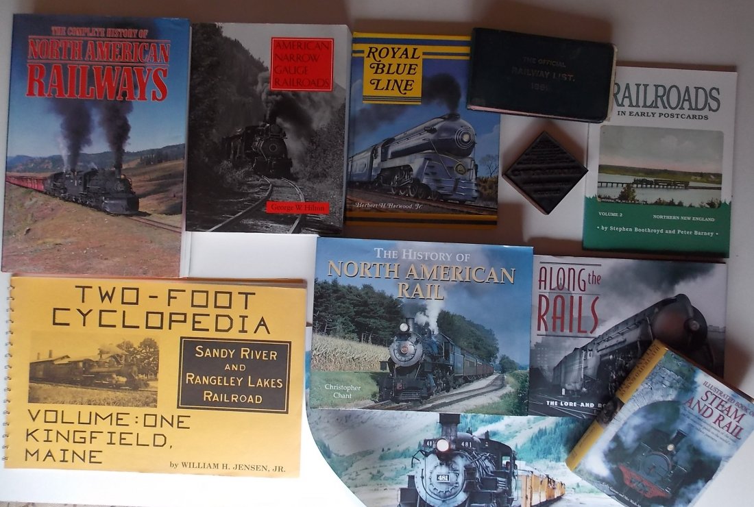 Books, Printers Block, Colorado Photo: An eclectic group that includes several books a 20" by 16" color photo of a Colorado Tourist Railroad scene and a Printers "Caution" diamond shaped block. The books inlude: Narrow Gauge Cyclopedia Vol
