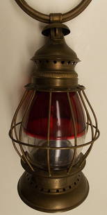 Red / Clear Brass Fireman's Lantern: A fine example of a 2 colored globe in a beautiful solid brass frame. There is a brass plate with STEAMER soldered to the base area. The bail is a hollow ring and the top area has a nice fancy reverse