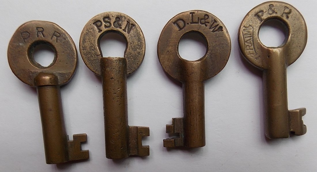 Brass Switch Keys: PRR, PS&N, P&R, DL&W: A group of four switch keys: (1) PRR made by Adlake (2) PS&N Pittsburg Shawmut & Northern (3) DL&W Delaware Lackawanna & Western with Fraim keystone hallmark - neat bit (4) P&R Philadelphia & Reading 