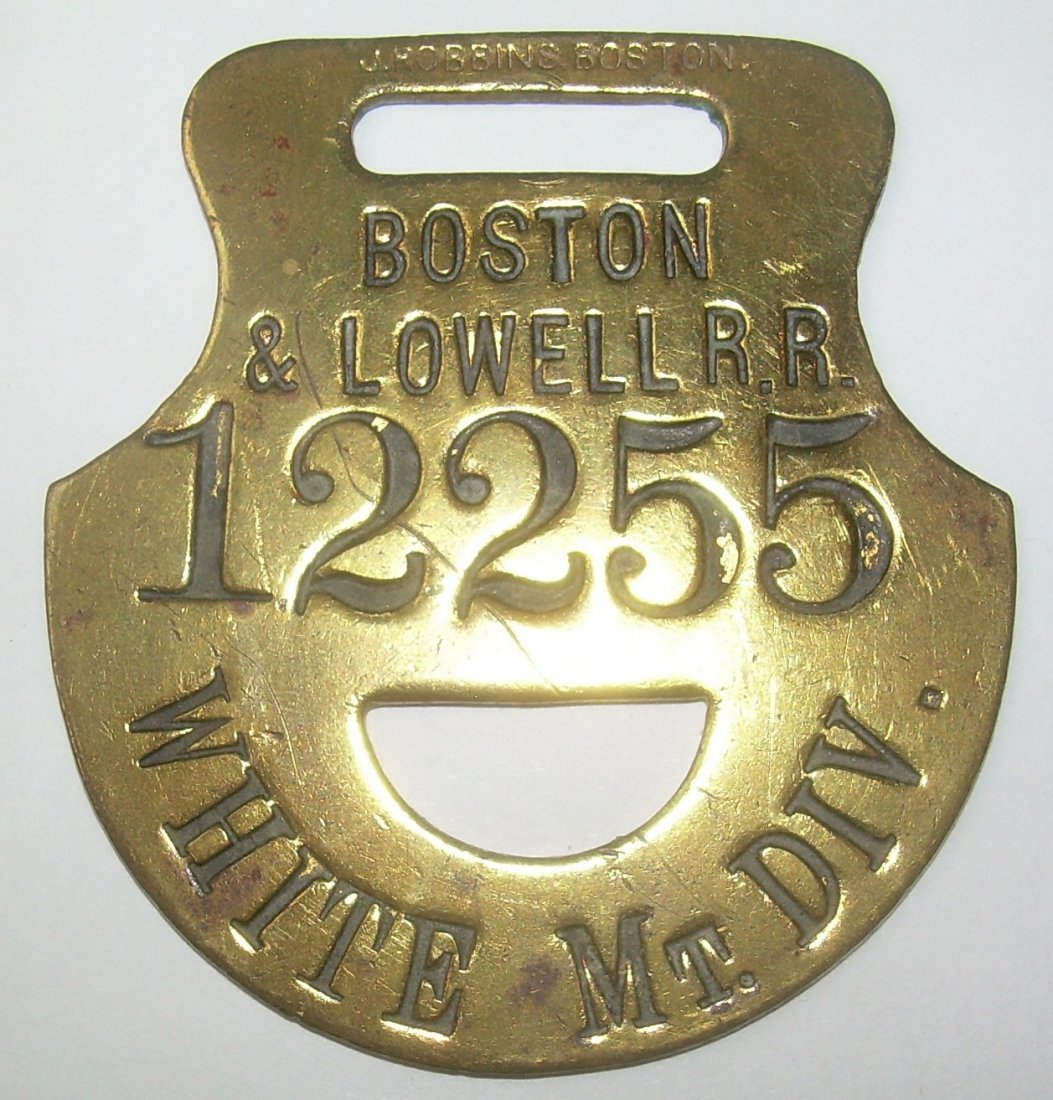 Boston & Lowell - White Mtn Div Baggage Tag: A great baggage tag from the time that the Boston & Lowell Railroad controlled the Boston Concord & Montreal Railroad. The markings are fantastic. It is tag number 12255 and it has a John Robbins hall