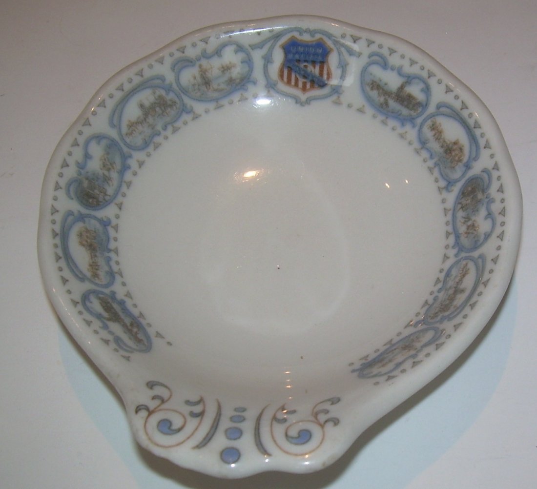Union Pacific Historical China Ice Cream Dish - as is: A Union Pacific Railroad china handled ice cream cup. Made by Syracuse in their "Old Ivory" style china. It has a chip/flake off of the bottom of the handle. The china has a colorful UP shield at 12:0