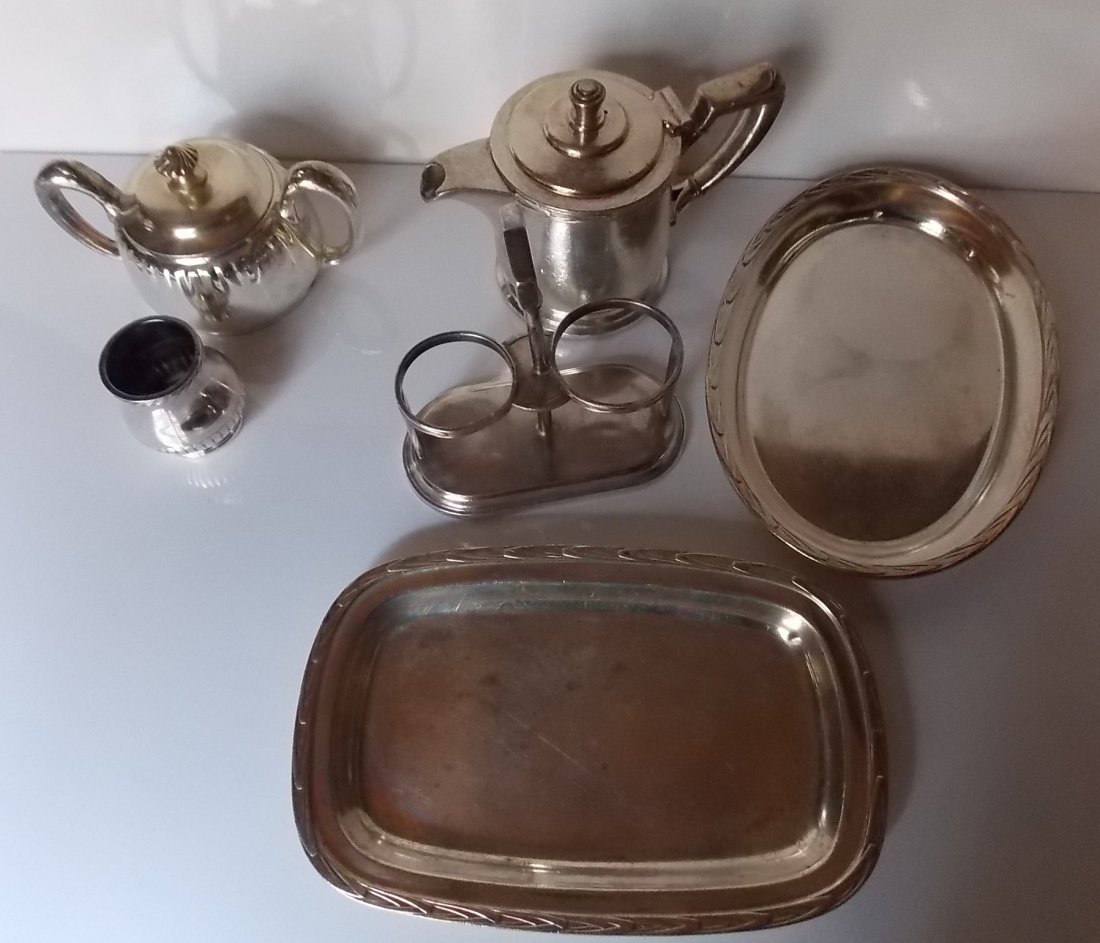 New Haven Railroad Silver Holloware (4+2): 4 pieces of silverplate made for the New York New Haven & Hartford Railroad and two additional pieces that match New Haven patterns but are not railroad marked: (1) rectangular tray 8 1/2" by 5 1/4" -