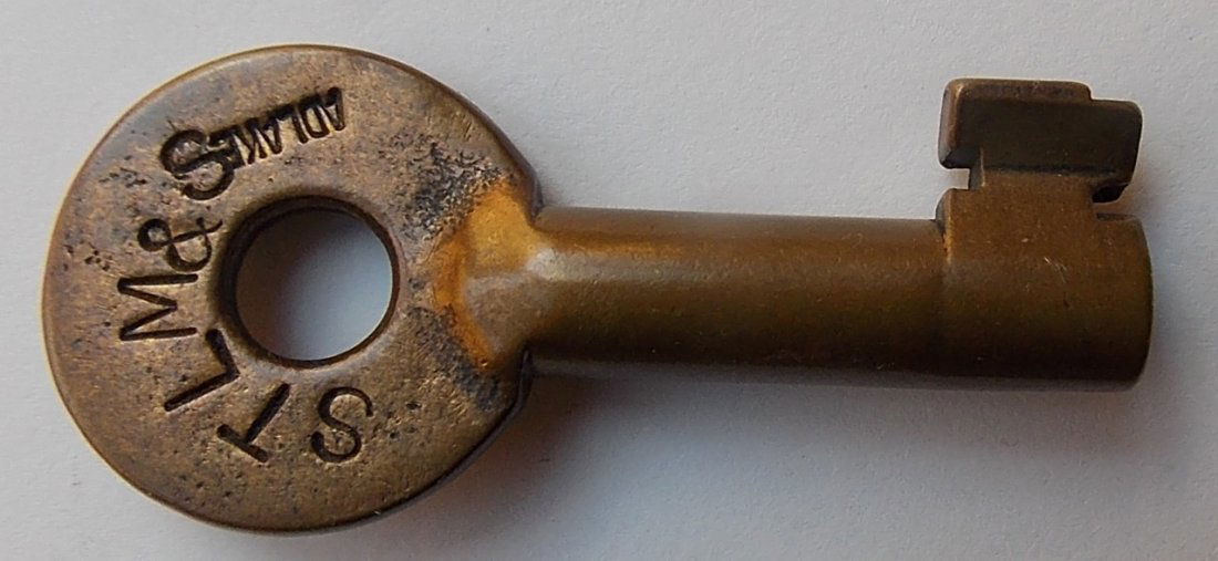 St Louis Memphis & Southeastern Switch key: This Frisco Railroad predecessor existed from 1902 - 1907 when the Frisco moved in. It is marked Adlake over the STM&S initials on the front. It has 01084 in a straight line on the reverse.