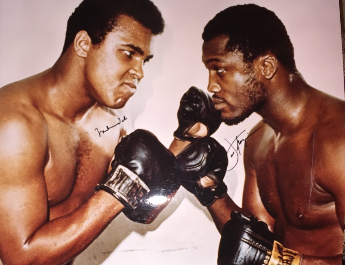 Ali and Frazier signed Photo: Glossy photo signed by Ali and Frazier. Comes with certificate from local sports collector. Item was siezed from Germany"s "Bernie Madoff" Half Billion Dollar Ponzi Schemer, Ulrich Engler. Aprox retai
