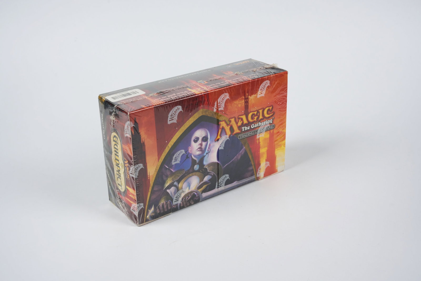 Guildpact Factory Sealed Booster Box: A factory sealed booster box of Guildpact, featuring 36 booster packs.The seal on this item has some signs of wear, there is one rip on the side but a major straight tear directly down the centre of t