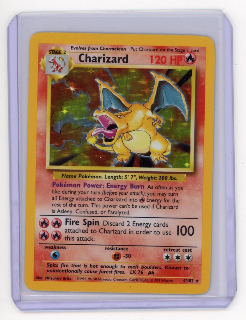 Charizard #4 Holo - Base Set 1999 (LP): This stunning Charizard #4 holo Base Set (1999) is a particularly great Light Play copy. While a small dent is visible on the back surface, alongside some very minor border and surface wear, the examp