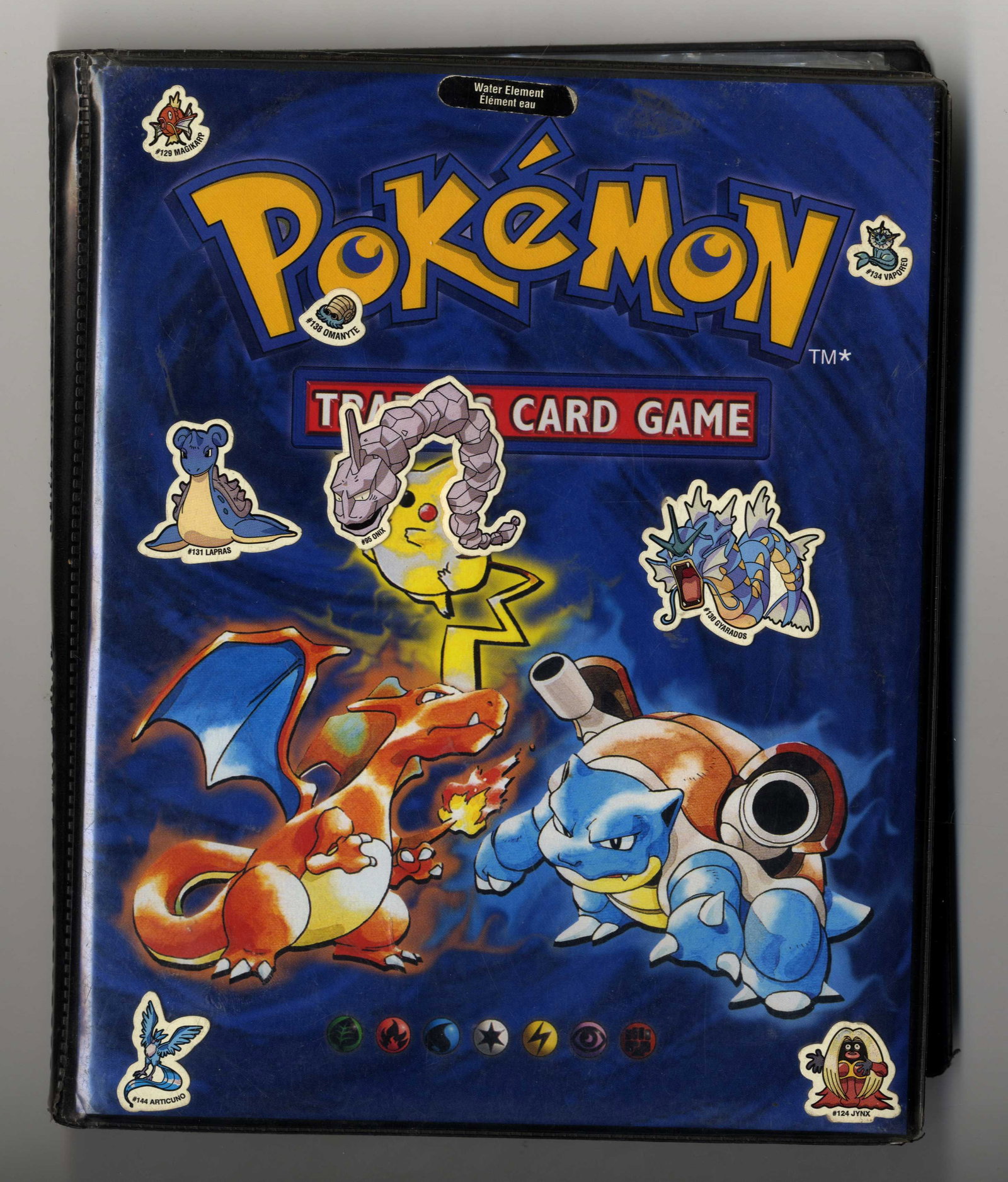 Base Set Partially Complete Set + Original Binder: A partially complete Base Set, including x4 holos and approximately 100 other cards (some duplicates included). This is very much so a childhood collection, and as such the original WOTC binder has so