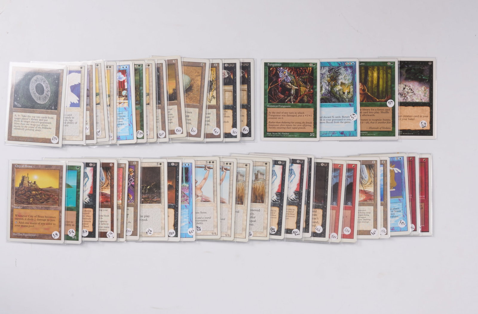 Unlimited, Revised, 4th Edition, 5th Edition Collection: This lot features a combination of partially completed sets from the white-bordered Unlimited, Revised, 4th Edition, and 5th Edition sets. With hundreds of commons, uncommons, rares, and lands, this