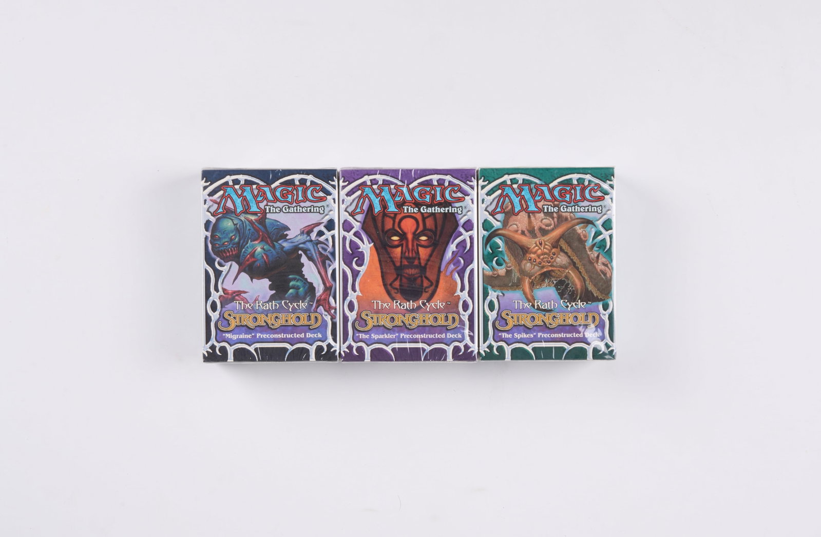 Stronghold Sealed Theme Deck Set: This lot features x3 sealed theme Decks from the Stronghold expansion. It includes: the ?Migraine?, ?The Sparkler?, and ?The Spikes? 60 card decks. Each deck is factory sealed and in excellent
