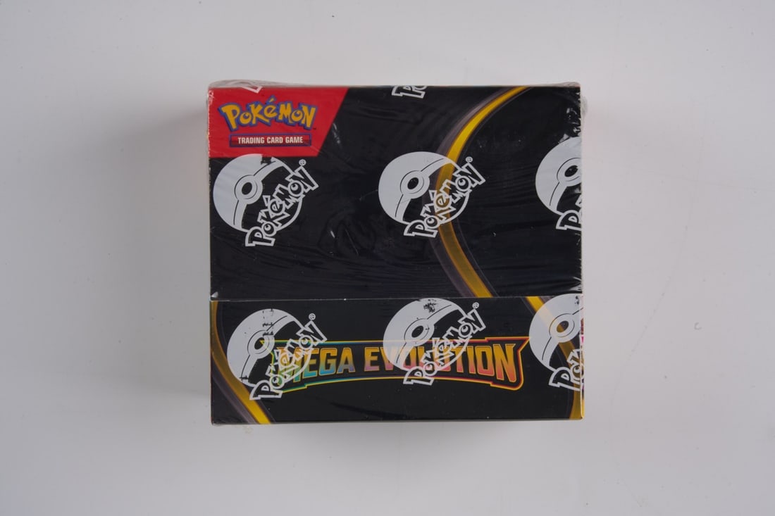 Mega Evolution Booster Box Sealed: This lot conatcins a factory sealed booster box, the box contains 36 sealed booster packs. The box has no tears in the seal and firm rigid corners.
