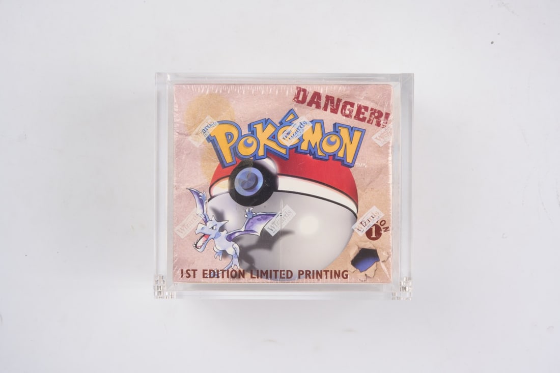 Pokémon 1st Edition Fossil Sealed Booster Box 1999: Released in October 1999, the Fossil expansion was the third ever Pokémon TCG set. This 1st Edition booster box contains 36 booster packs of 11 cards for a total of 396 cards. It is sealed in its