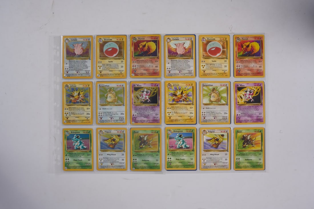Jungle Complete Set Unlimited 64/64 (NM): This lot features a complete Jungle set, released in 1999. The general condition of the set is in the NM range, as the cards were pulled from boosters and put straight into 9 pocket pages over 25 year