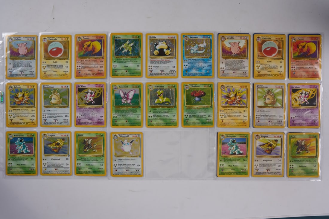 Jungle Complete Set 64/64: A complete set of the Jungle expansion (1999), in a wide range of conditions. Of the x16 holos, the highlights and their conditions are:Flareon #3 MP - dirt and scuffs on the back of the card along +