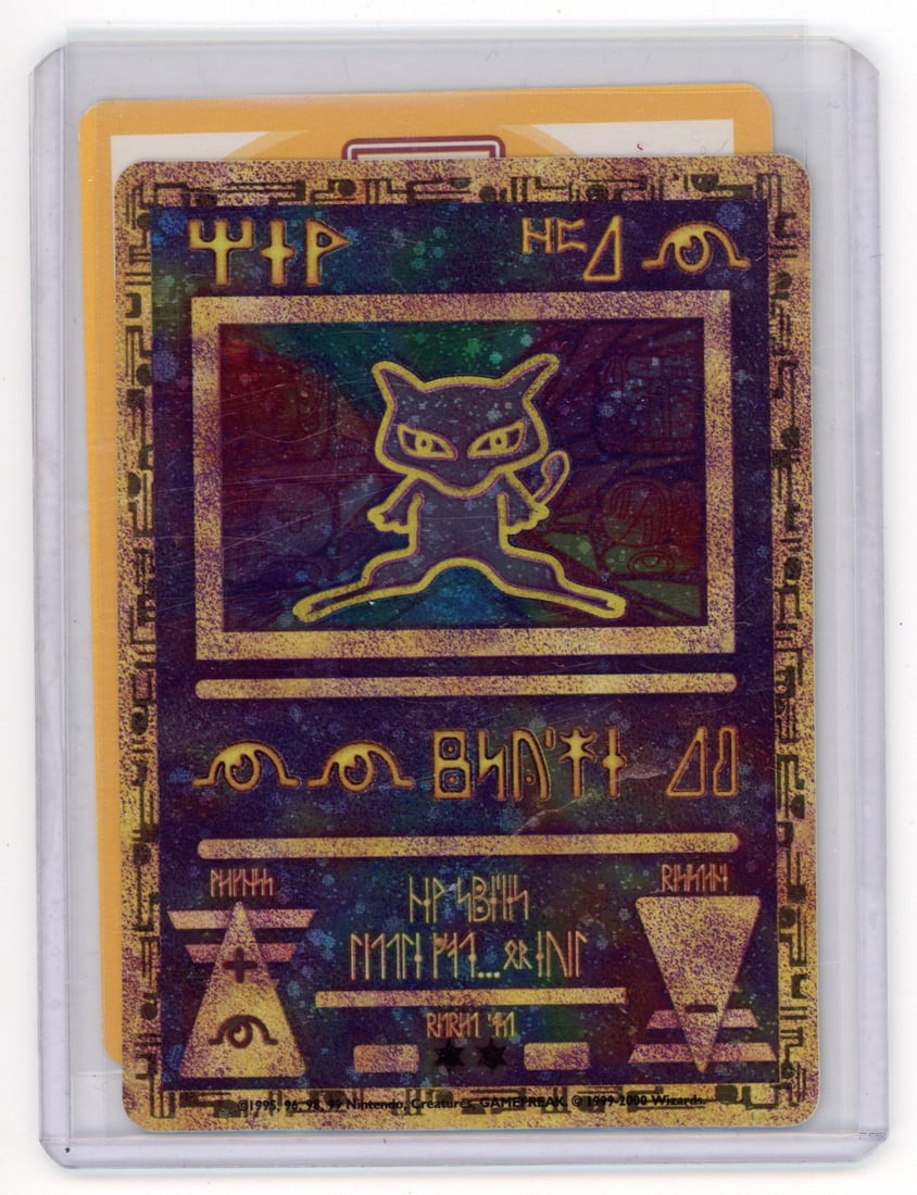 Ancient Mew Promo - Pokemon Movie 2000 (VLP): This gorgeous Ancient Mew Promo, handed out during the Pokemon Movie 2000, is in Very Lightly Played condition.Very light corner wear shows some wear, extremely typical for this card due to the dual f