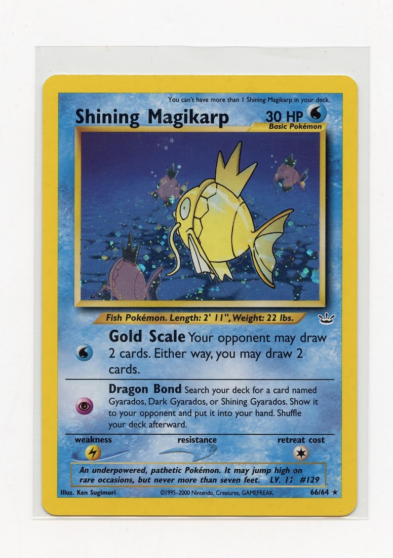 Shining Magikarp #66 Holo Neo Revelations - LP+: Shining Magikarp #66 Holo from the Neo Revelations set, in Light Play+ condition. This card looks fantastic, but does have some light surface wear that stops it from acheiving a Near Mint grading.