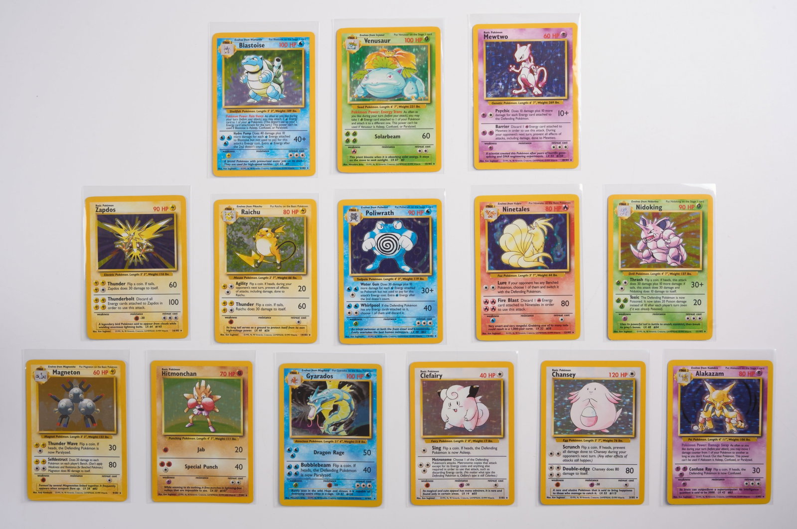 Base Set - Unlimited x14 Holo Set: This set features x14 of the original Base Set holos, missing only Machamp and Charizard.The holos in this bundle are all between very light play to near mint condition, with only extremely light wear