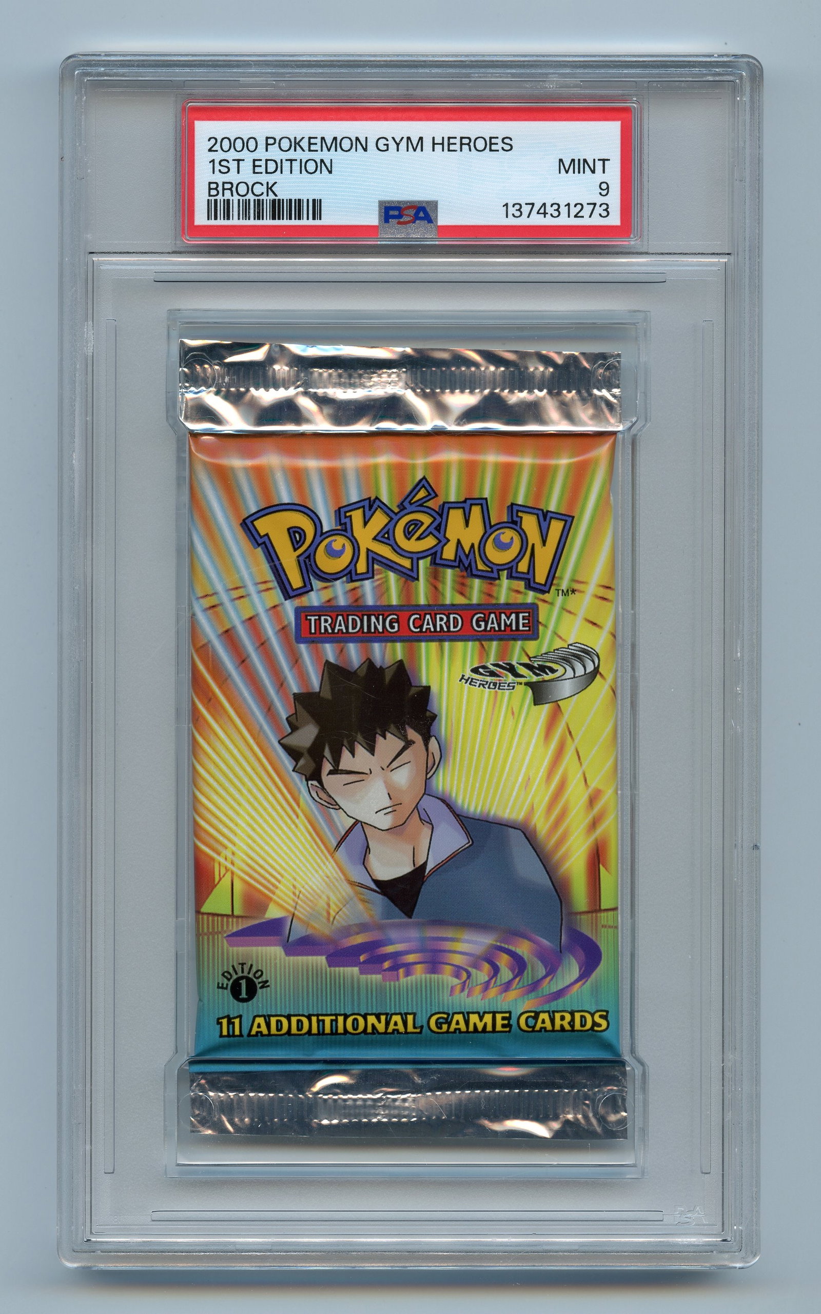 PSA 9 Gym Heroes 1st Edition Booster Pack - Brock Artwork: A MINT 9 graded booster pack from the 1st Edition printing of Gym Heroes, released in 2000.This stunning example looks factory fresh, and features the Brock artwork alongside the coveted 1st Edition s