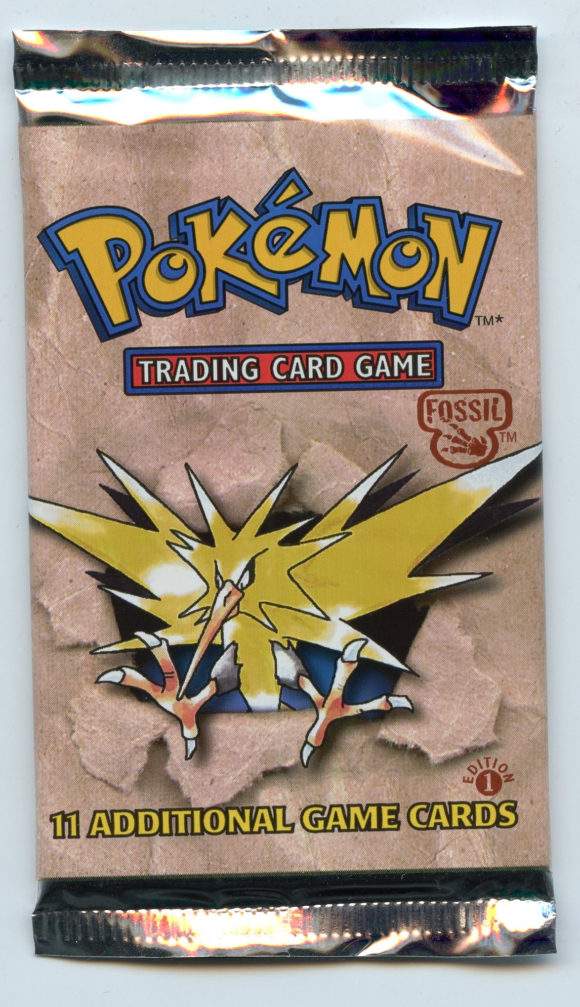 Fossil 1st Edition Sealed Booster Pack - Zapdos Artwork: A factory sealed Fossil 1st Edition booster pack from 1999, featuring the Zapos artwork, in good condition. This pack looks fantastic, with a strong shine and all original seals and gluing in tact.