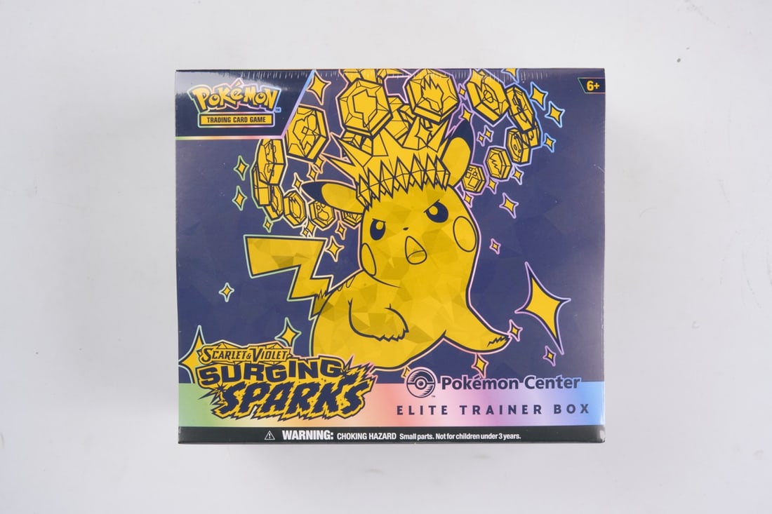 Pokemon Center Surging Sparks Elite Trainer Box - sealed: This lot contains a factory sealed Surging Sparks Pokemon Center ETB. The product comes with extar booster packs and a stamped promo. This item is perfectly sealed with no tears in the wrapping and ov