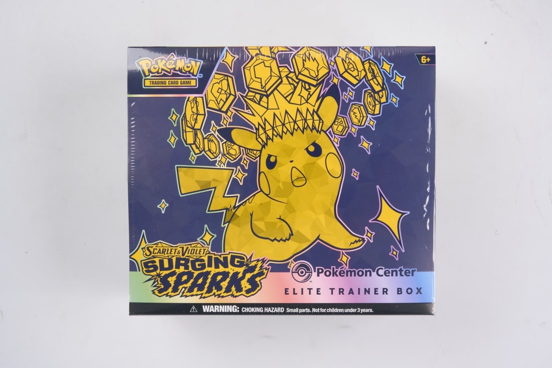 Pokemon Center Surging Sparks Elite Trainer Box - sealed: This lot contains a factory sealed Surging Sparks Pokemon Center ETB. The product comes with extar booster packs and a stamped promo. This item is perfectly sealed with no tears in the wrapping but so