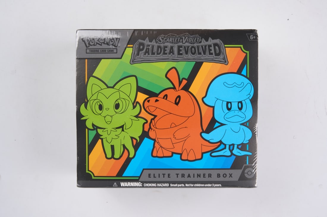 Paldea Evolved Elite Trainer Box - sealed: This lot contains a factory sealed Paldea Evolved ETB. The product comes with booster packs and a promoThis item is perfectly sealed with no tears in the wrapping and but does have a few dented/blunte