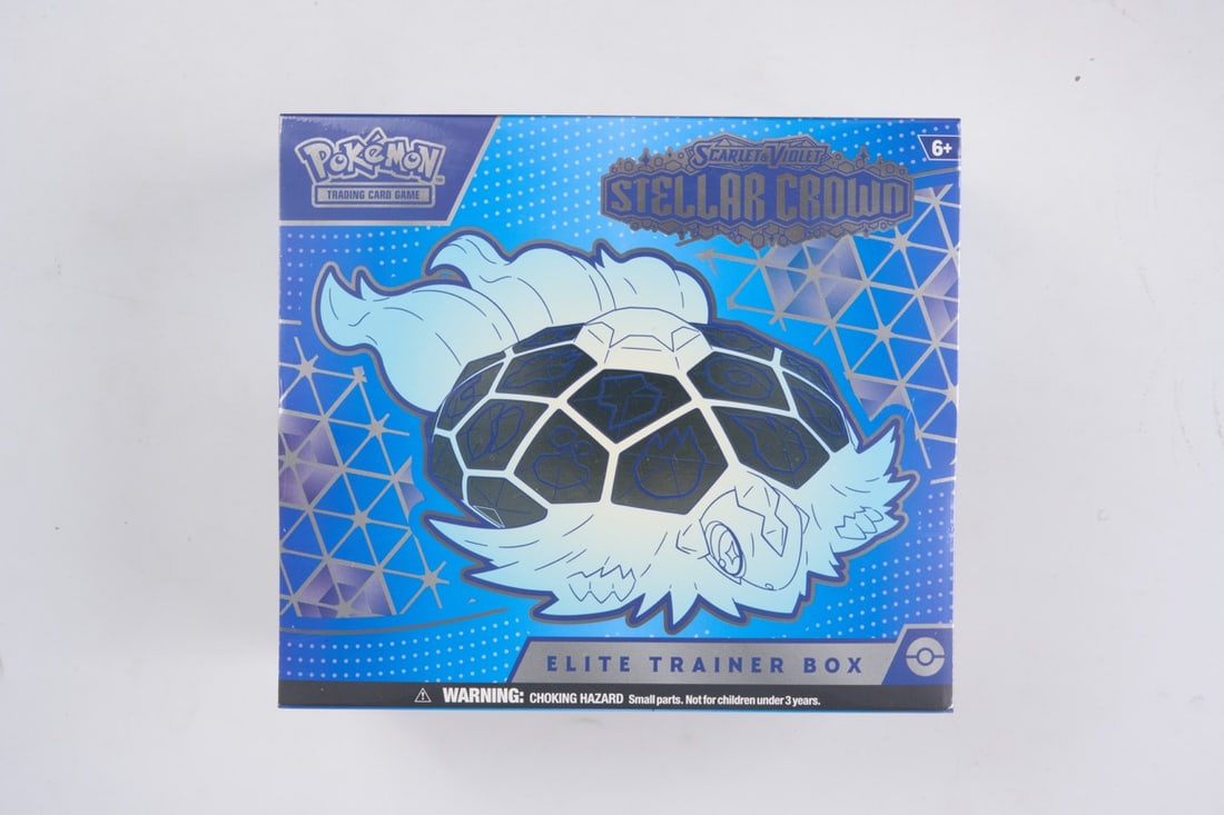 Stellar Crown Elite Trainer Box - sealed: This lot contains a factory sealed Stellar Crown ETB. The product comes with booster packs and a promoThis item is perfectly sealed with no tears in the wrapping and is in overall good shape.