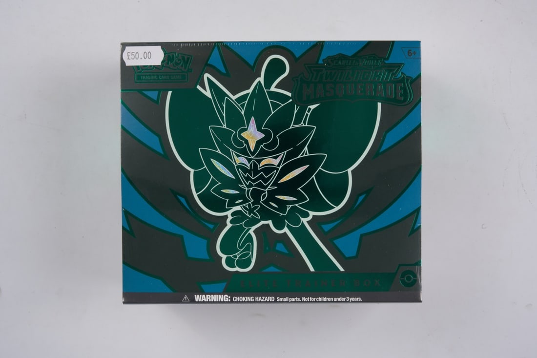 Twilight Masquerade Elite Trainer Box - Sealed: This lot contains a factory sealed Twilight Masquerade ETBThe item contains 9 sealed booster packs and the Ogerpon promo. The item is perfectly wrapped and in overall great condition but it does have 