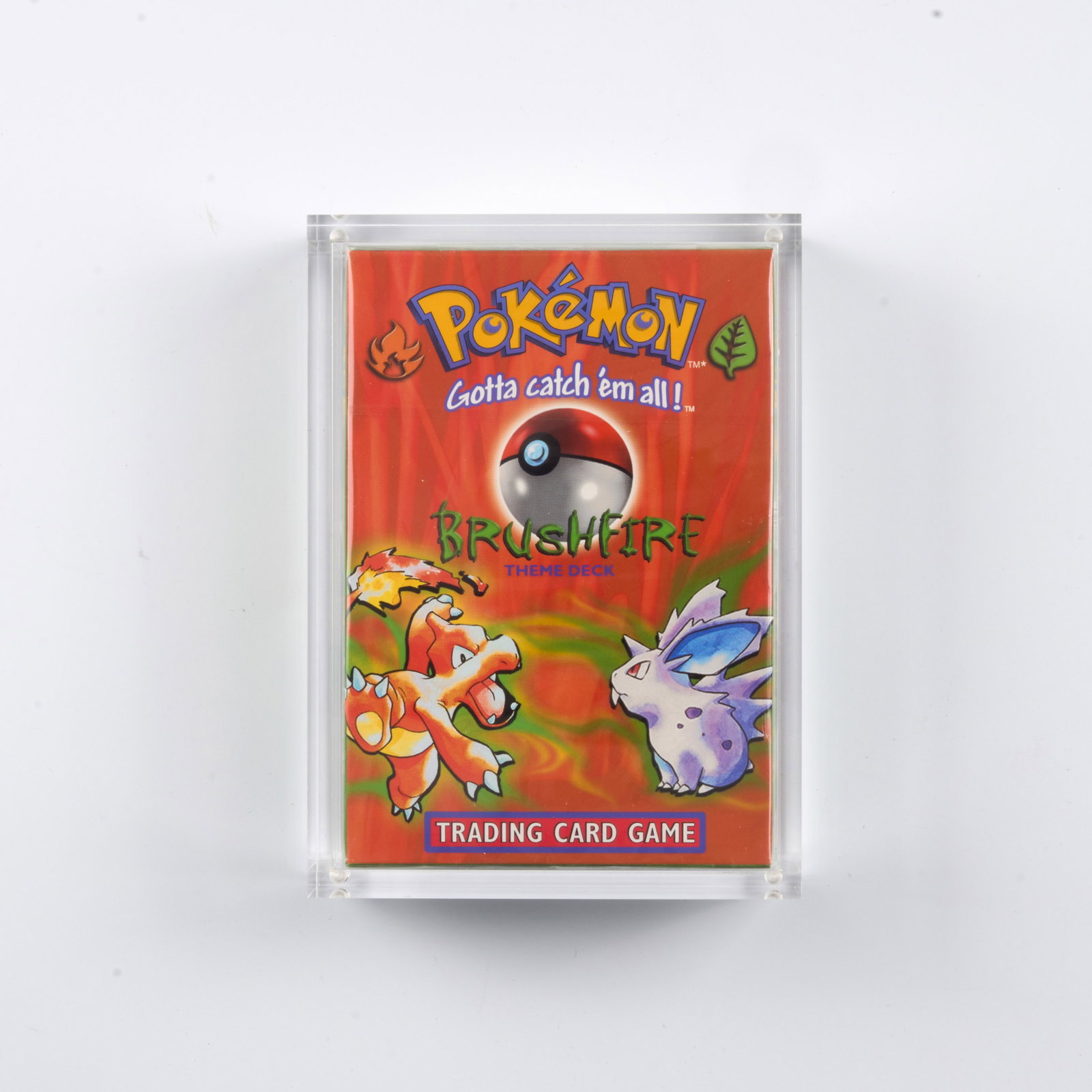 Brushfire Theme Deck - Factory Sealed Inc. Acrylic Case: A factory sealed 'Brushfire' Theme Deck, which includes a 60-card deck, damage counters, a custom coin, a rulebook, and a card list. Released January 9, 1999. This is a fantastic example, looking fact
