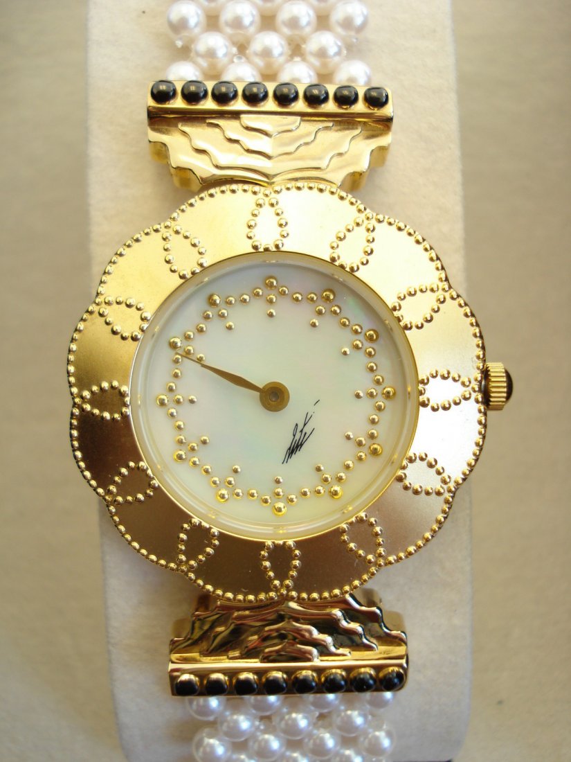 Mother of Pearl Erte Watch.: Watch comes with a nice display box and certificate of authenticity