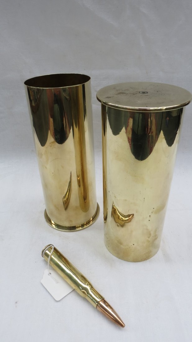 A pair of shell cases of Great War from Imperial German: A pair of shell cases of Great War from Imperial Germany, 21cm high, also a Reminton 50 cal bullet with brass case.
