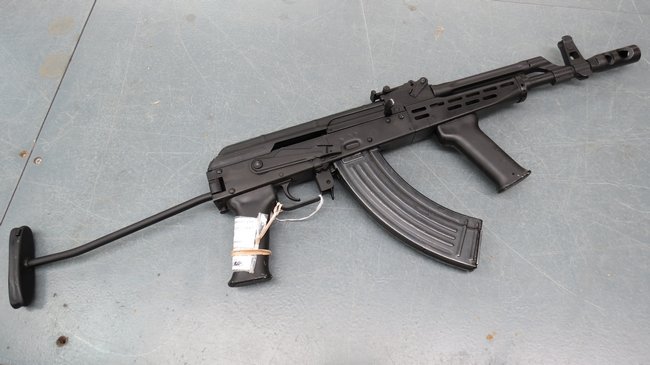 A deactivated AMD65 (AK47) rife and magazine in a black: A deactivated AMD65 (AK47) rife and magazine in a black matt finish and Paratroopers stock with deactivation certificate. Serial No 391.