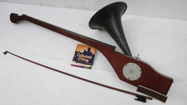 A Stroviols concert model one stringed violin with pain: A Stroviols concert model one stringed violin with painted speaker horn. Reg. No 877208; also bow (AF) and strings c.90cm.