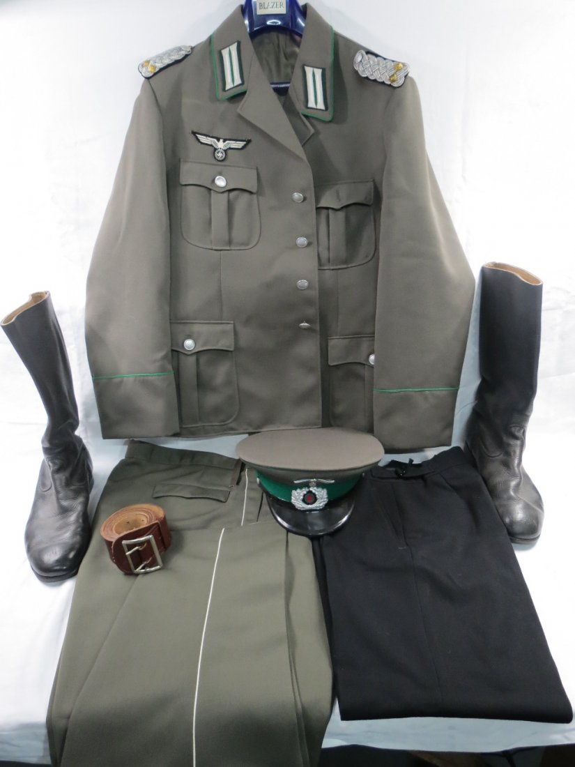 An East German officer's uniform with attached 3rd: An East German officer's uniform with attached 3rd Reich badge, also cap, boots and belt.