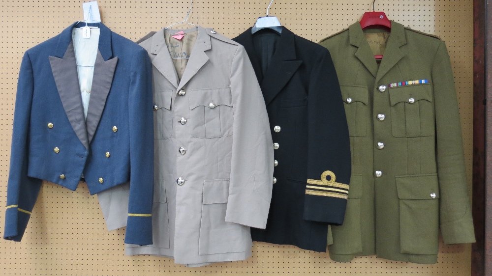 An RAF Mess jacket, together with Naval tunic, Army: An RAF Mess jacket, together with Naval tunic, Army tunic and Tropical tunic.