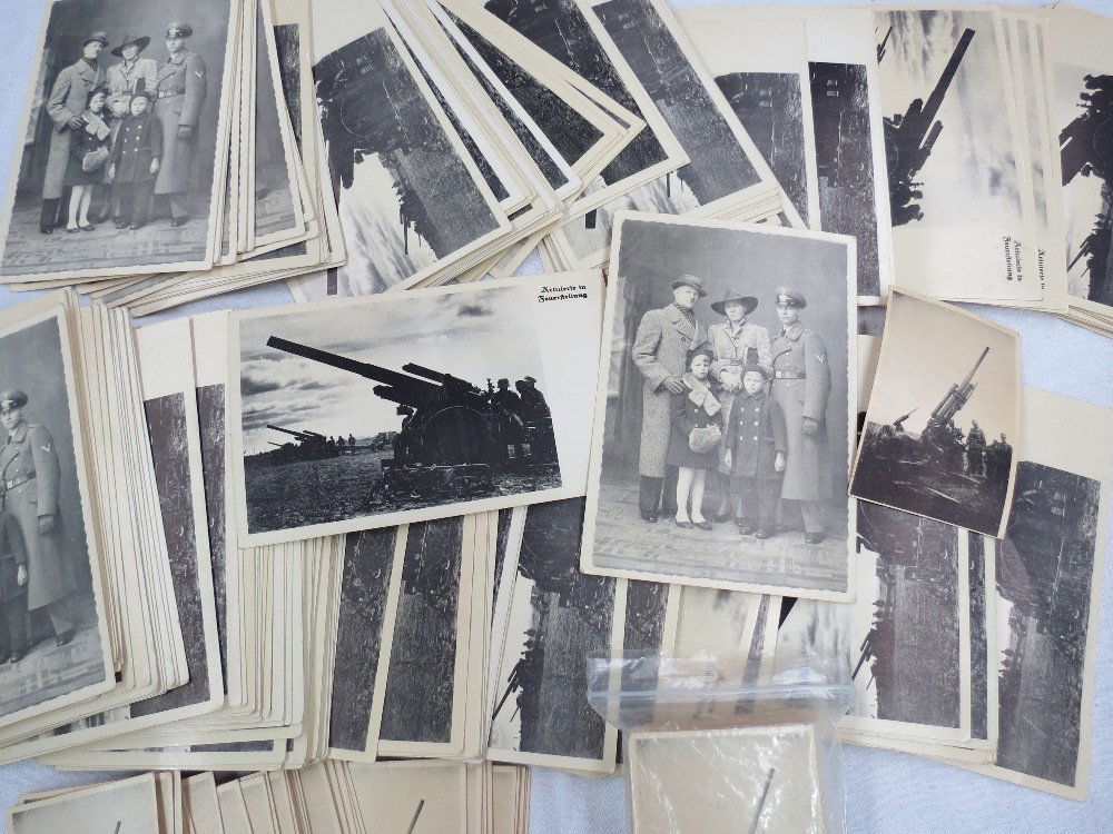 A quantity of German photographs of Third Reich era,: A quantity of German photographs of Third Reich era, depicting artillery pieces, the ideal Aryan family etc.
