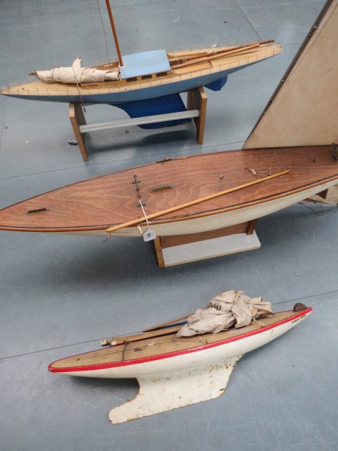 A Pond yacht ' Ocean Star', 61cm and a large racing: A Pond yacht ' Ocean Star', 61cm and a large racing pond yacht approximately 90cm also another with deck house and partial rigging, 90cm. (Three items).