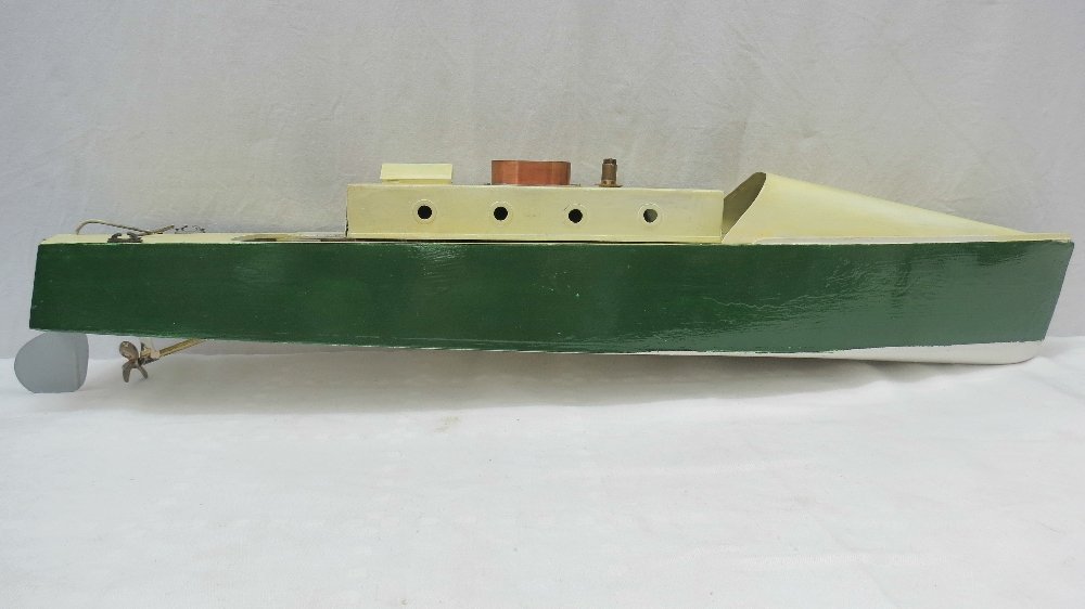 A Basset Lowke steam launch complete with boiler etc: A Bassett Lowke steam launch complete with boiler etc for live steam within planing hull, new cream and green paintwork. 69cm overall.